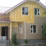 фото: утепление деревянного дома под сайдинг